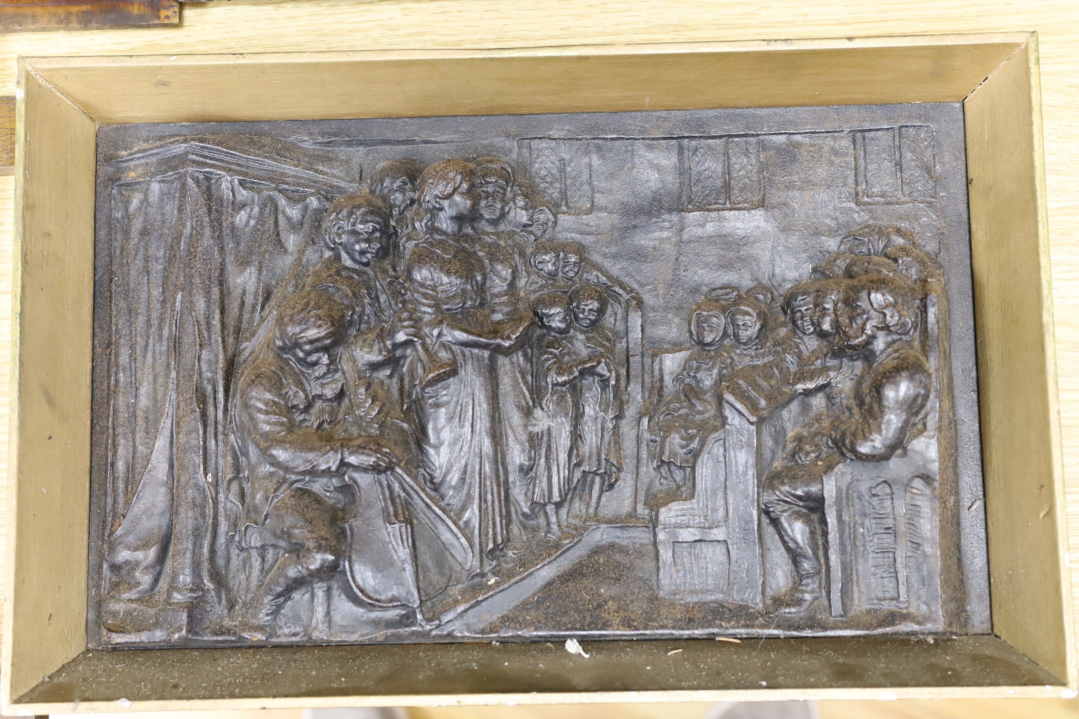 Three assorted cast metal panels together with a carved walnut panel, 39x40cm